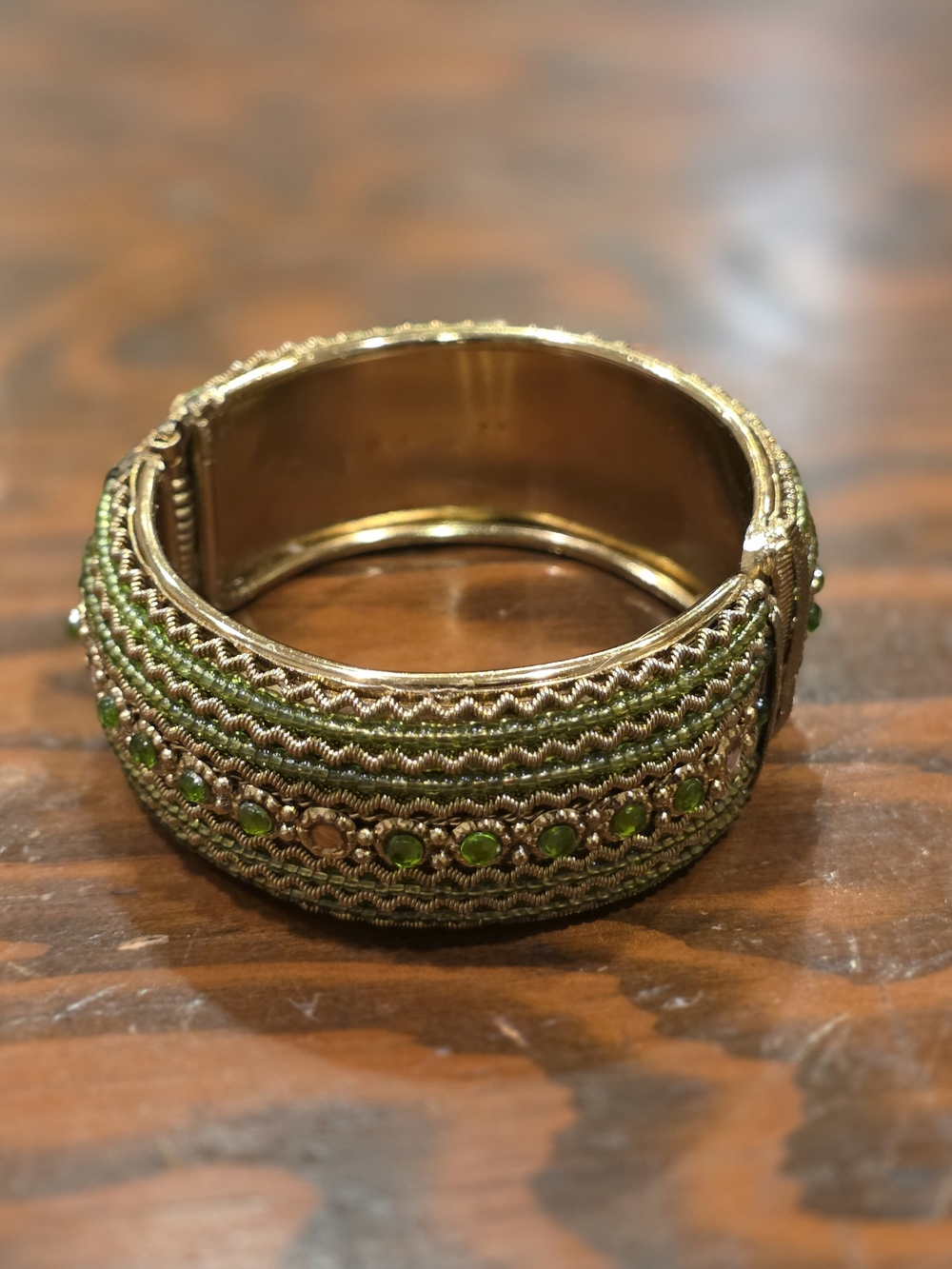 Gold-Tone Bangle Bracelet with Green Crystal Embellishments